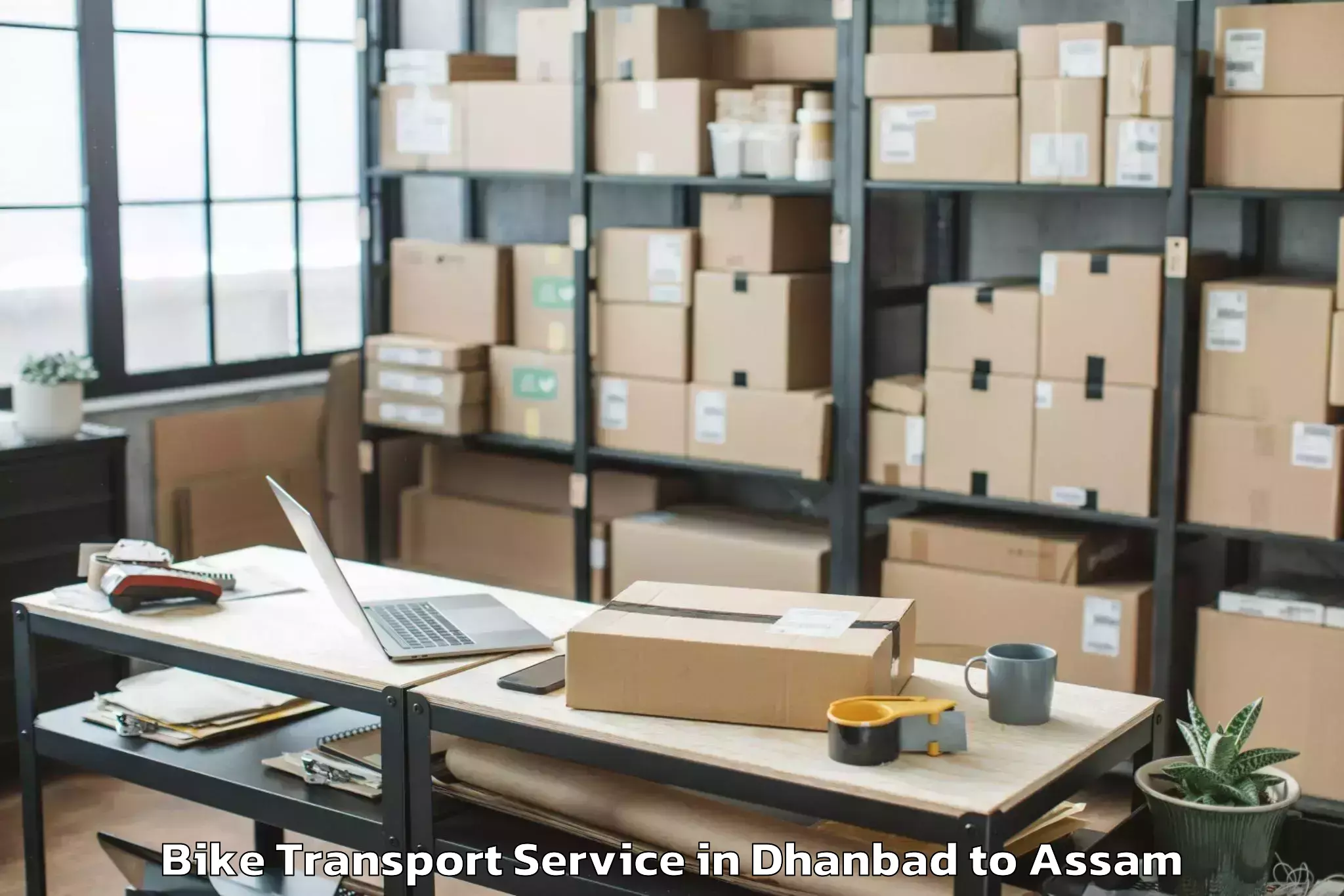 Book Dhanbad to Rangapara Bike Transport Online